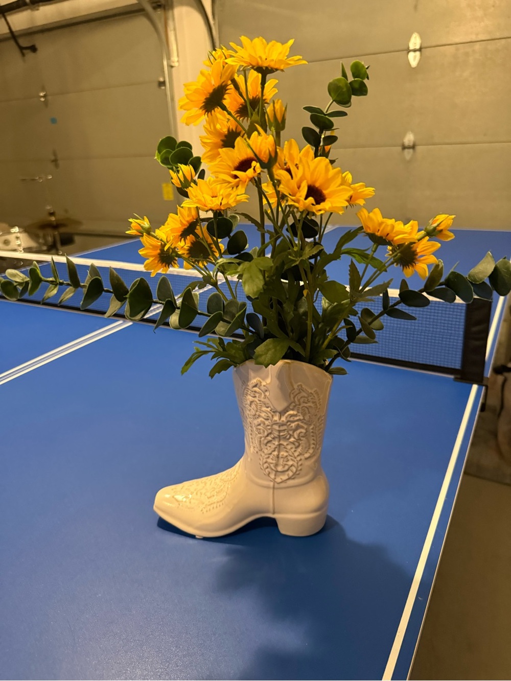 White Ceramic Cowboy Boot Vase with Yellow Sunflower Stems